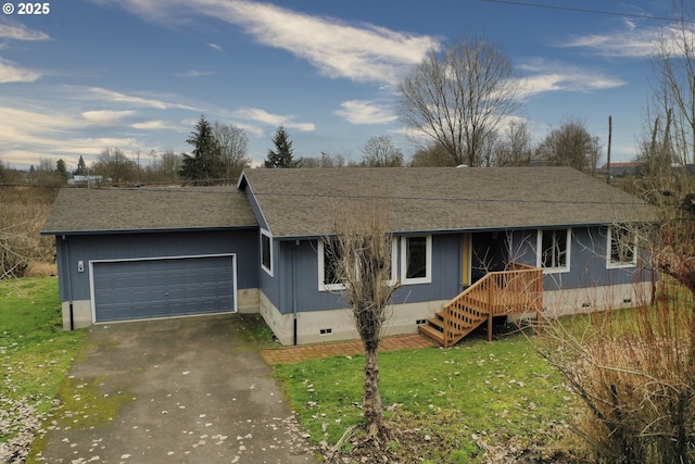 single story home featuring a front yard and a garage