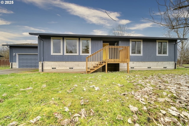 view of front of property with a front lawn and a garage