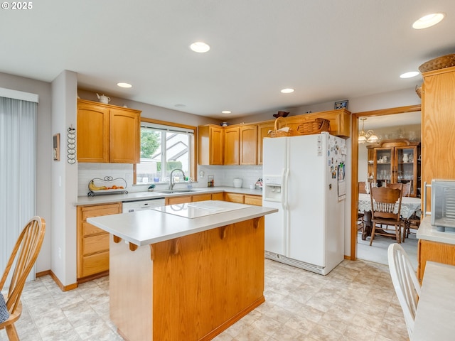 1136 S Pine St, Canby, OR 97013 - kitchen featuring white fridge with ice dispenser, light countertops, electric cooktop, recessed lighting, and tasteful backsplash