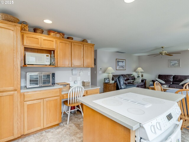 1136 S Pine St, Canby, OR 97013 - kitchen with white appliances, open floor plan, light countertops, a center island, and recessed lighting