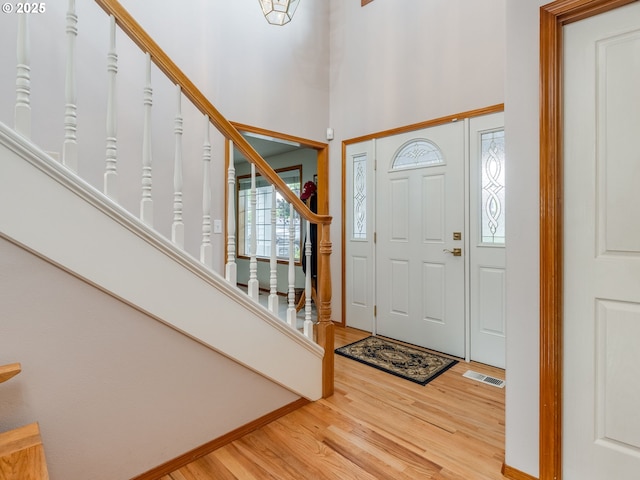 1136 S Pine St, Canby, OR 97013 - entrance foyer with light wood-style floors, stairway, and a high ceiling