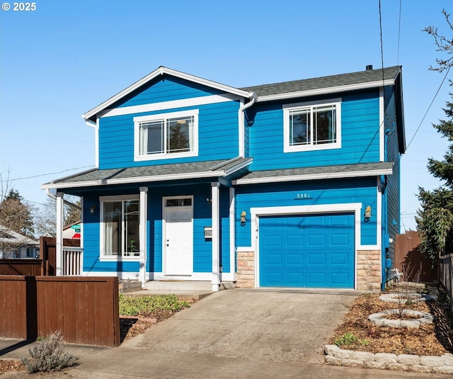 view of front facade with a garage and covered porch