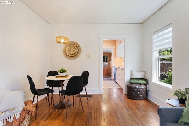 9935 N Lombard St, Portland, OR 97203 - dining space with light wood finished floors, baseboards, and ornamental molding