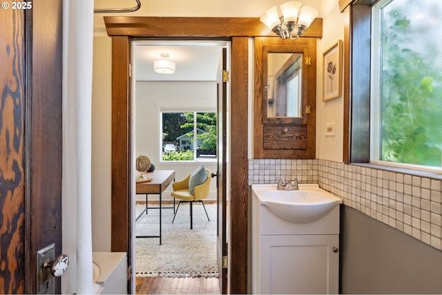 9935 N Lombard St, Portland, OR 97203 - bathroom with vanity and wood finished floors