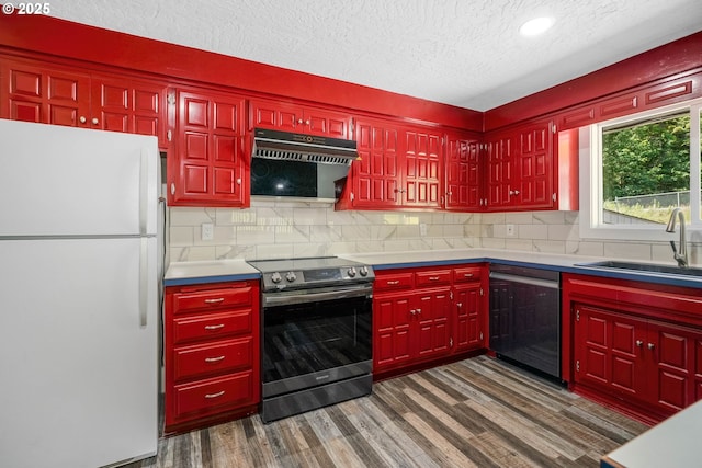 16170 Mcbee Rd, Dallas, OR 97338 - kitchen with appliances with stainless steel finishes, under cabinet range hood, a sink, dark wood-style floors, and a textured ceiling