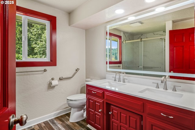 16170 Mcbee Rd, Dallas, OR 97338 - bathroom featuring plenty of natural light, toilet, a stall shower, wood finished floors, and recessed lighting