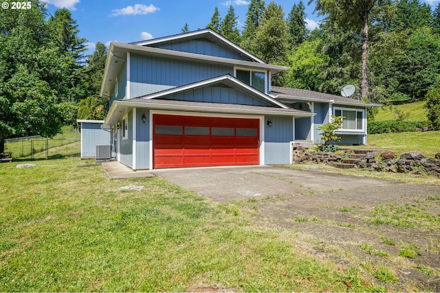 16170 Mcbee Rd, Dallas, OR 97338 - split level home with driveway, central AC unit, and a garage