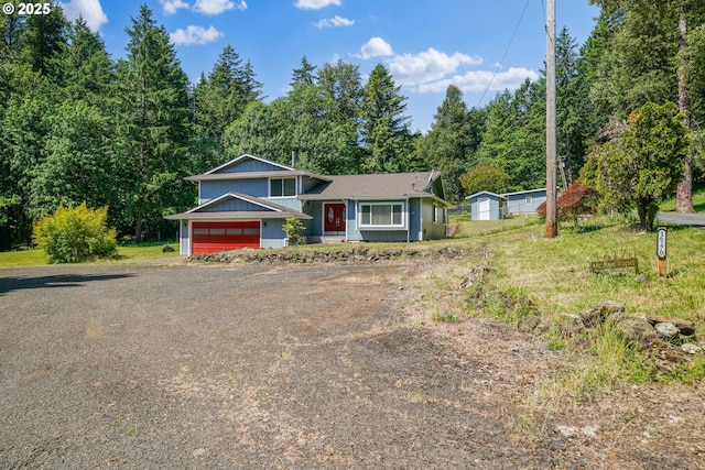 16170 Mcbee Rd, Dallas, OR 97338 - split level home featuring dirt driveway and a garage
