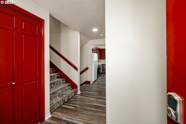 16170 Mcbee Rd, Dallas, OR 97338 - entryway with dark wood-type flooring, a textured ceiling, recessed lighting, baseboards, and stairway