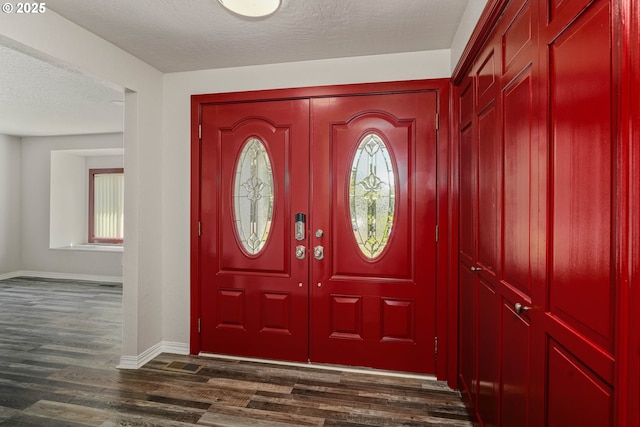 16170 Mcbee Rd, Dallas, OR 97338 - foyer with baseboards, dark wood-type flooring, and a textured ceiling