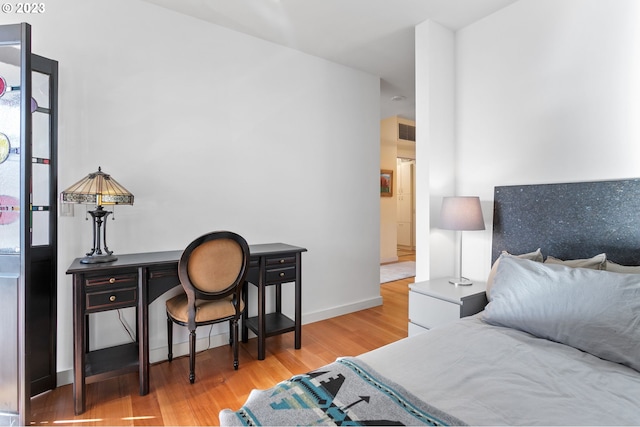 bedroom with light wood-type flooring