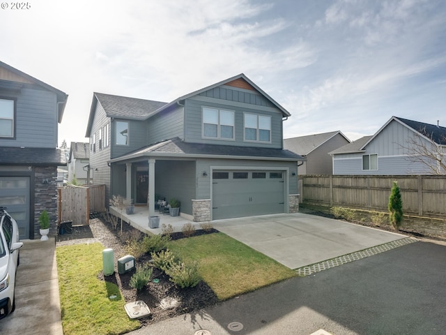 craftsman-style house featuring a garage and a front lawn