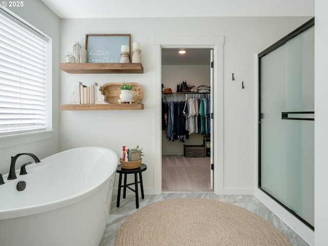 bathroom featuring separate shower and tub