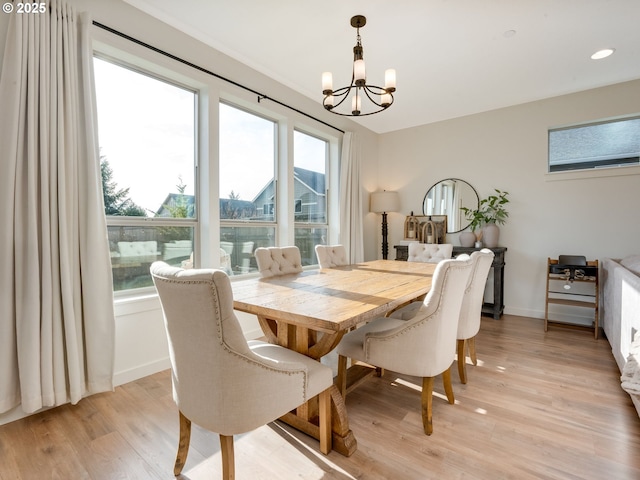 dining room featuring a chandelier and light hardwood / wood-style floors