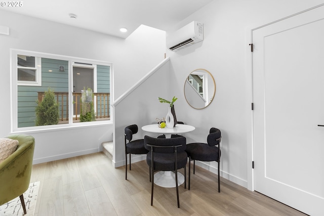 913 NE Sumner St, Portland, OR 97211 - dining area featuring a wall mounted air conditioner, wood finished floors, and recessed lighting
