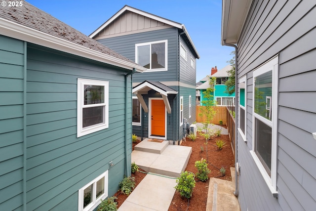 913 NE Sumner St, Portland, OR 97211 - doorway to property featuring board and batten siding