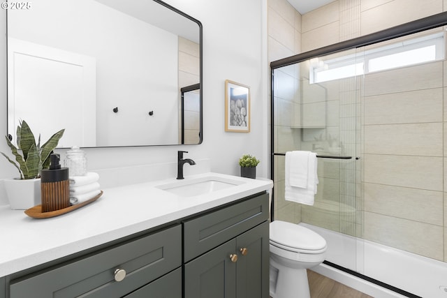 913 NE Sumner St, Portland, OR 97211 - bathroom with vanity, a stall shower, and wood finished floors