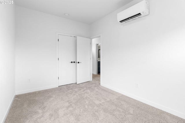 913 NE Sumner St, Portland, OR 97211 - unfurnished bedroom featuring a wall mounted AC, carpet flooring, and a closet