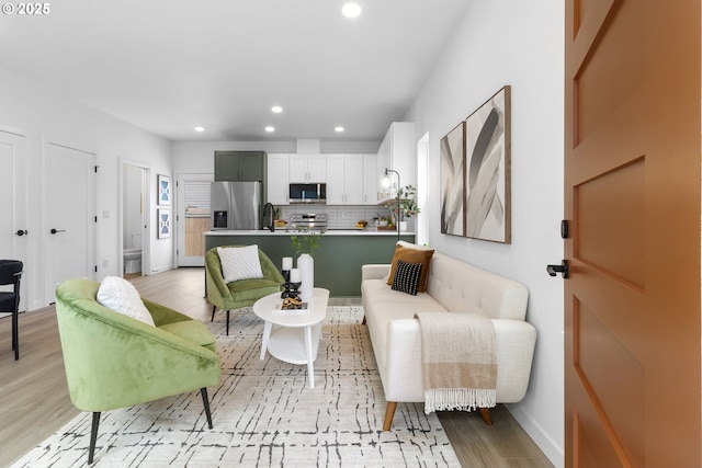 913 NE Sumner St, Portland, OR 97211 - living area with recessed lighting and light wood-style floors