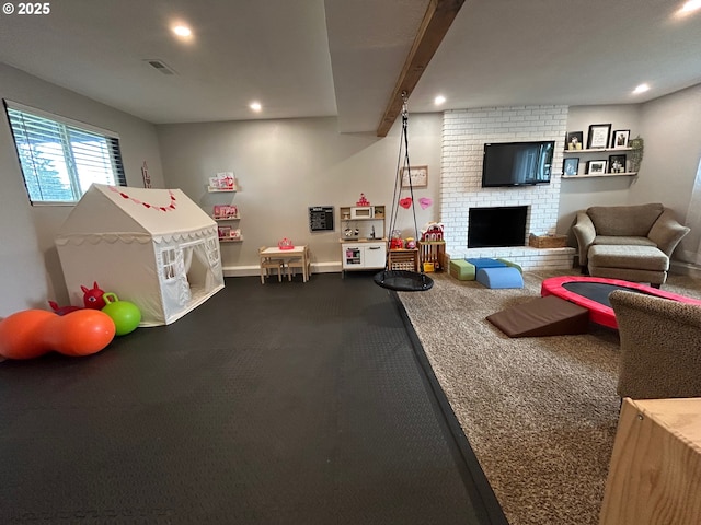 playroom with a fireplace