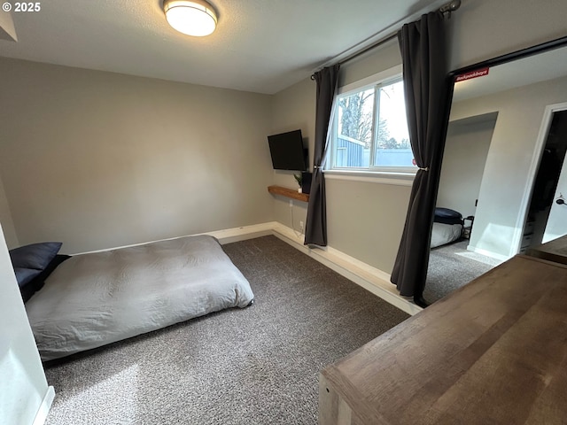 bedroom with carpet flooring and a textured ceiling