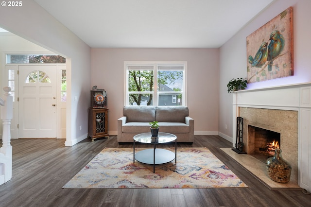 28575 SW Sandalwood Dr, Wilsonville, OR 97070 - living area with wood finished floors, baseboards, and a fireplace