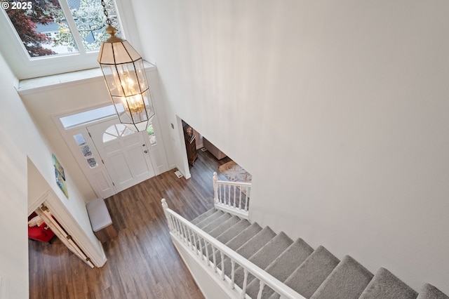 28575 SW Sandalwood Dr, Wilsonville, OR 97070 - entrance foyer with a towering ceiling, stairs, wood finished floors, and a chandelier
