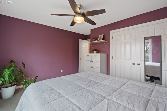 bedroom featuring a closet, carpet flooring, and a ceiling fan