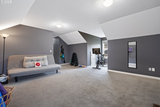 living area with a textured ceiling, baseboards, carpet, and vaulted ceiling