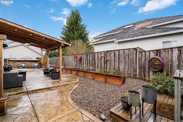 view of patio / terrace featuring an outdoor living space and a fenced backyard