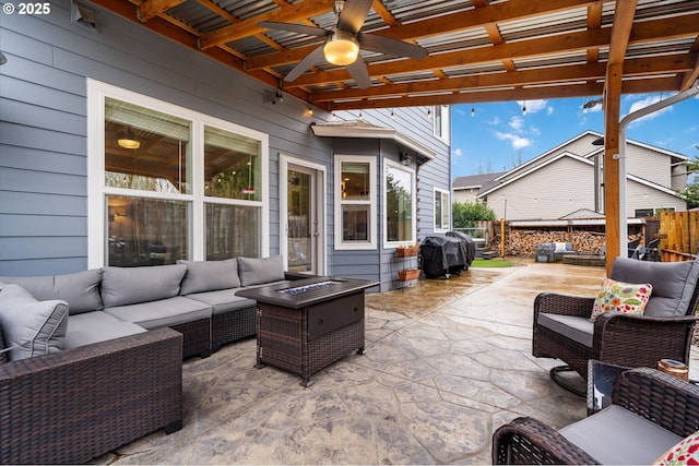 view of patio featuring grilling area, ceiling fan, fence, an outdoor hangout area, and a pergola