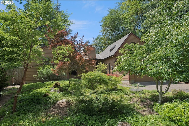 18194 Shady Hollow Way W, Linn, OR 97068 - view of yard featuring a garage and driveway