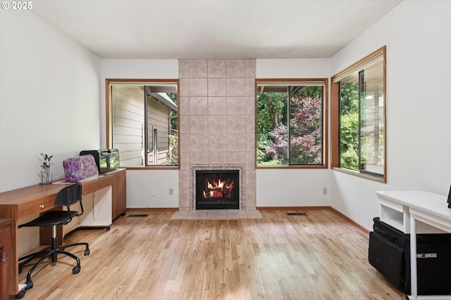 18194 Shady Hollow Way W, Linn, OR 97068 - home office featuring wood finished floors and a tiled fireplace