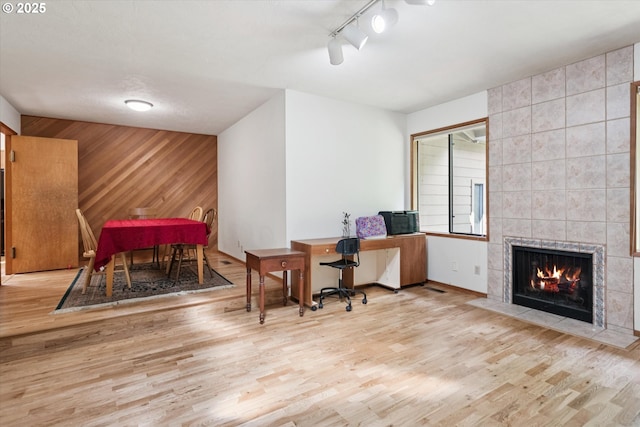 18194 Shady Hollow Way W, Linn, OR 97068 - office area with wood finished floors, wooden walls, and a fireplace