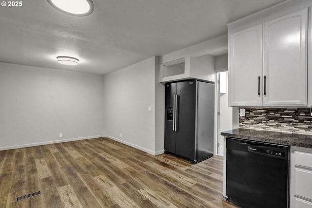 1262 Kalmia St, Junction City, OR 97448 - kitchen with white cabinets, dark countertops, backsplash, visible vents, and black appliances