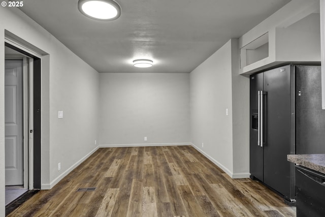 1262 Kalmia St, Junction City, OR 97448 - unfurnished dining area featuring dark wood-type flooring and baseboards