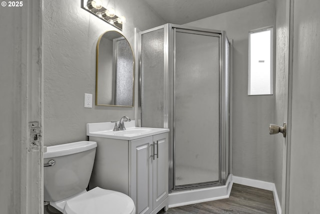 1262 Kalmia St, Junction City, OR 97448 - bathroom with vanity, a stall shower, a textured wall, and wood finished floors