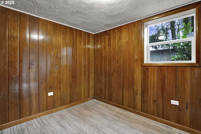 1262 Kalmia St, Junction City, OR 97448 - spare room featuring light wood-type flooring and wood walls