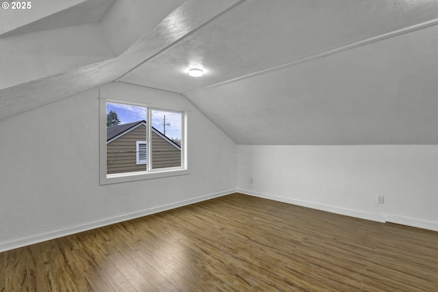1262 Kalmia St, Junction City, OR 97448 - bonus room featuring a textured ceiling, baseboards, wood finished floors, and lofted ceiling