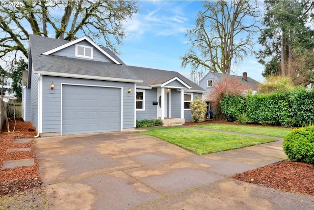 1262 Kalmia St, Junction City, OR 97448 - view of front of property with concrete driveway, an attached garage, a shingled roof, and a front yard