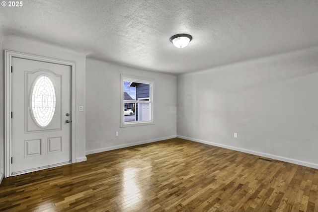 1262 Kalmia St, Junction City, OR 97448 - entryway featuring baseboards, a textured ceiling, and wood finished floors