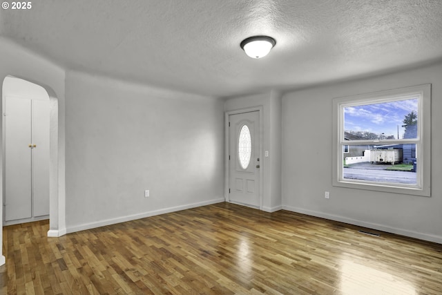 1262 Kalmia St, Junction City, OR 97448 - foyer featuring a textured ceiling, wood finished floors, and a wealth of natural light