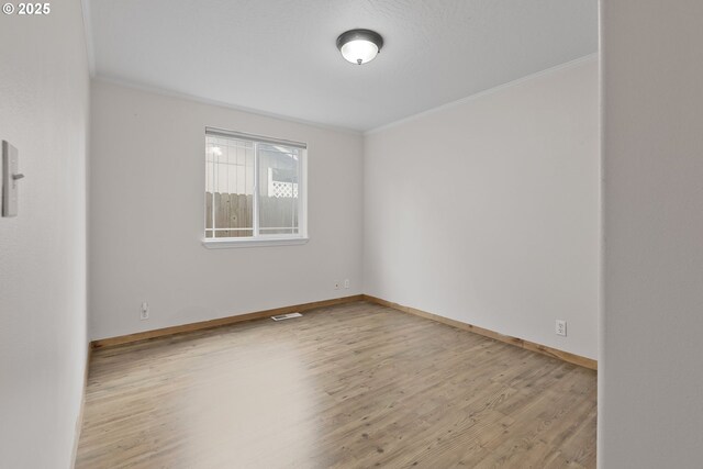 263 Ferndale Dr, Eugene, OR 97404 - unfurnished room featuring ornamental molding, wood finished floors, and baseboards