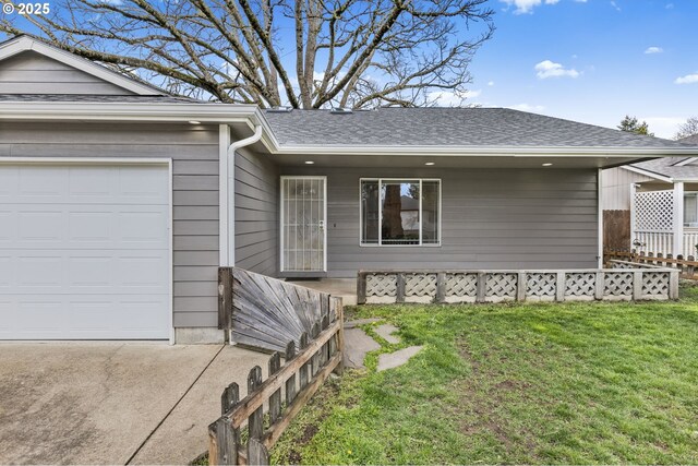 263 Ferndale Dr, Eugene, OR 97404 - view of front facade featuring a garage, roof with shingles, and driveway