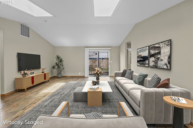 263 Ferndale Dr, Eugene, OR 97404 - living area with a skylight, vaulted ceiling, wood finished floors, and baseboards