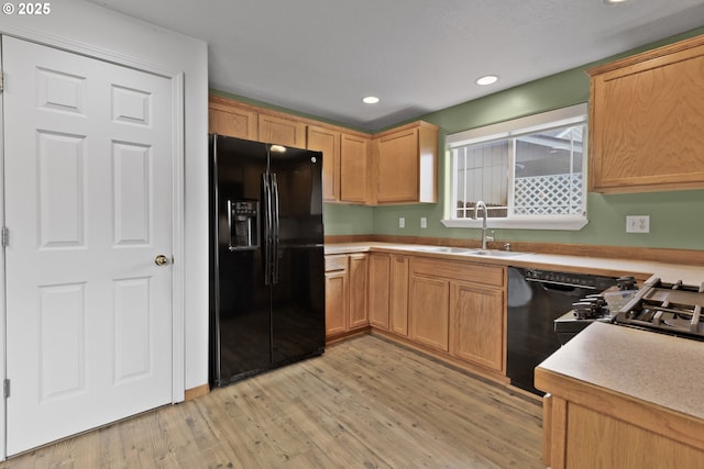 263 Ferndale Dr, Eugene, OR 97404 - kitchen featuring black appliances, a sink, light wood-type flooring, light countertops, and recessed lighting