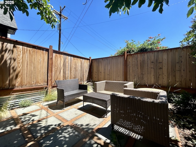 view of patio featuring an outdoor hangout area and a fenced backyard