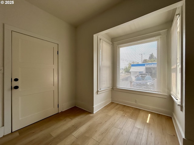 interior space with light wood-style flooring and baseboards