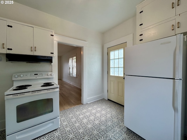 kitchen featuring white appliances, plenty of natural light, under cabinet range hood, and white cabinets