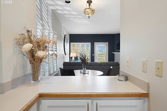 639 1st St, Lake Oswego, OR 97034 - kitchen with white cabinetry, light countertops, and open floor plan